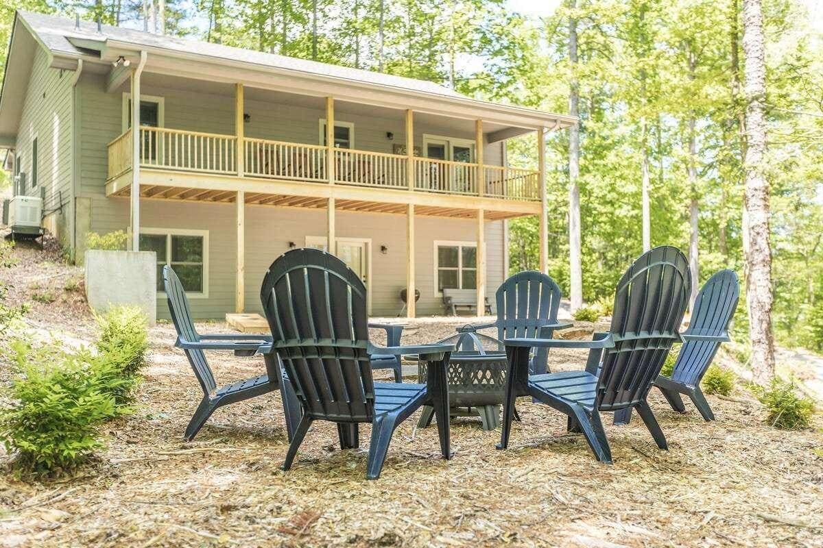 Outdoor fire pit area with six chairs