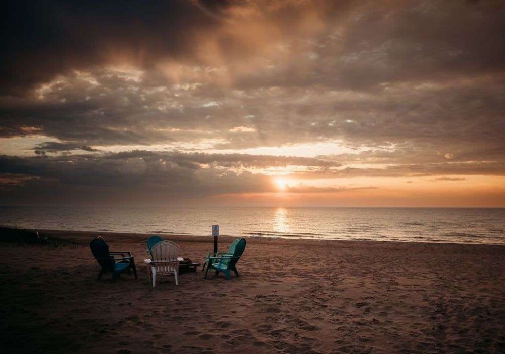 4 beach chairs on the beach